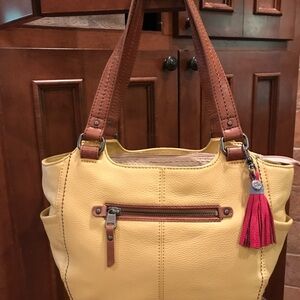 The Sak Kendra leather purse w/straw accent